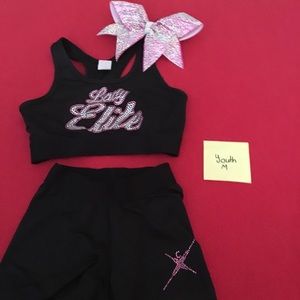 A Cheer Extreme Lady Elite practice wear w/ a bow